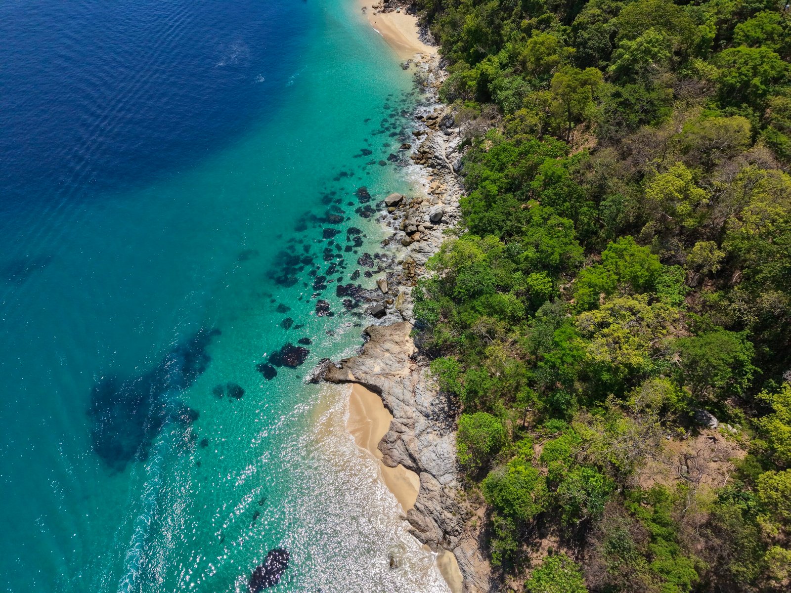 Rocky coastline and beach at Quimixto south of Puerto Vallarta